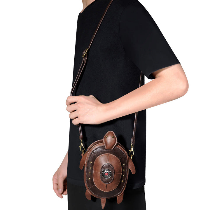 Hazel turtle crossbody bag worn over the shoulder